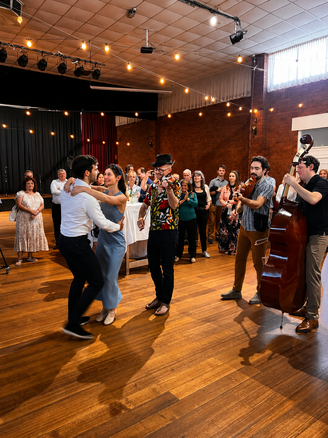 Guests dancing together on the hall floor